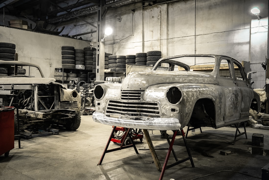 A classic car body shell mid-restoration in the shop